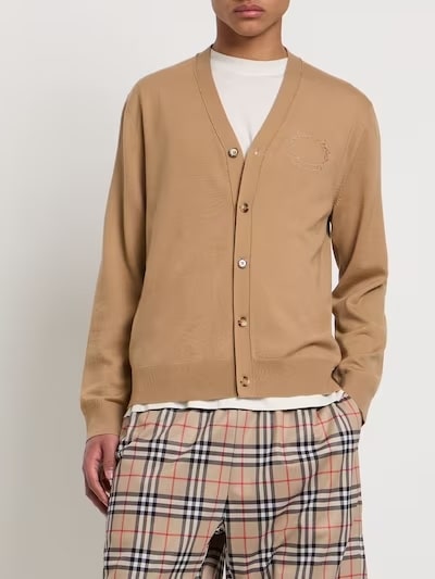 This photo shows a man wearing a brown cardigan from Burberry.